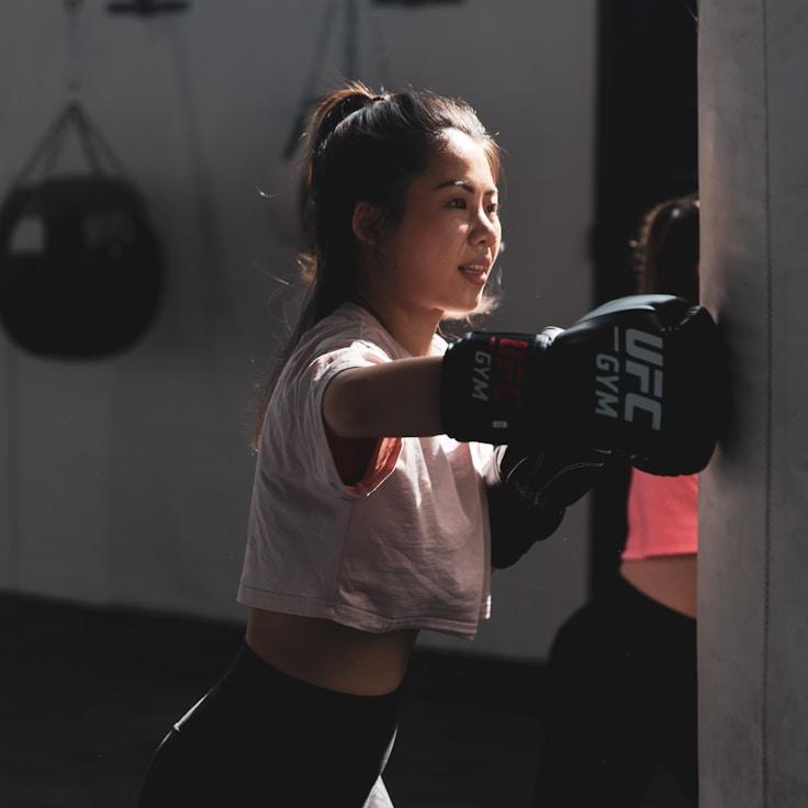 Women in a fitness class doing stretching and mobility exercises
